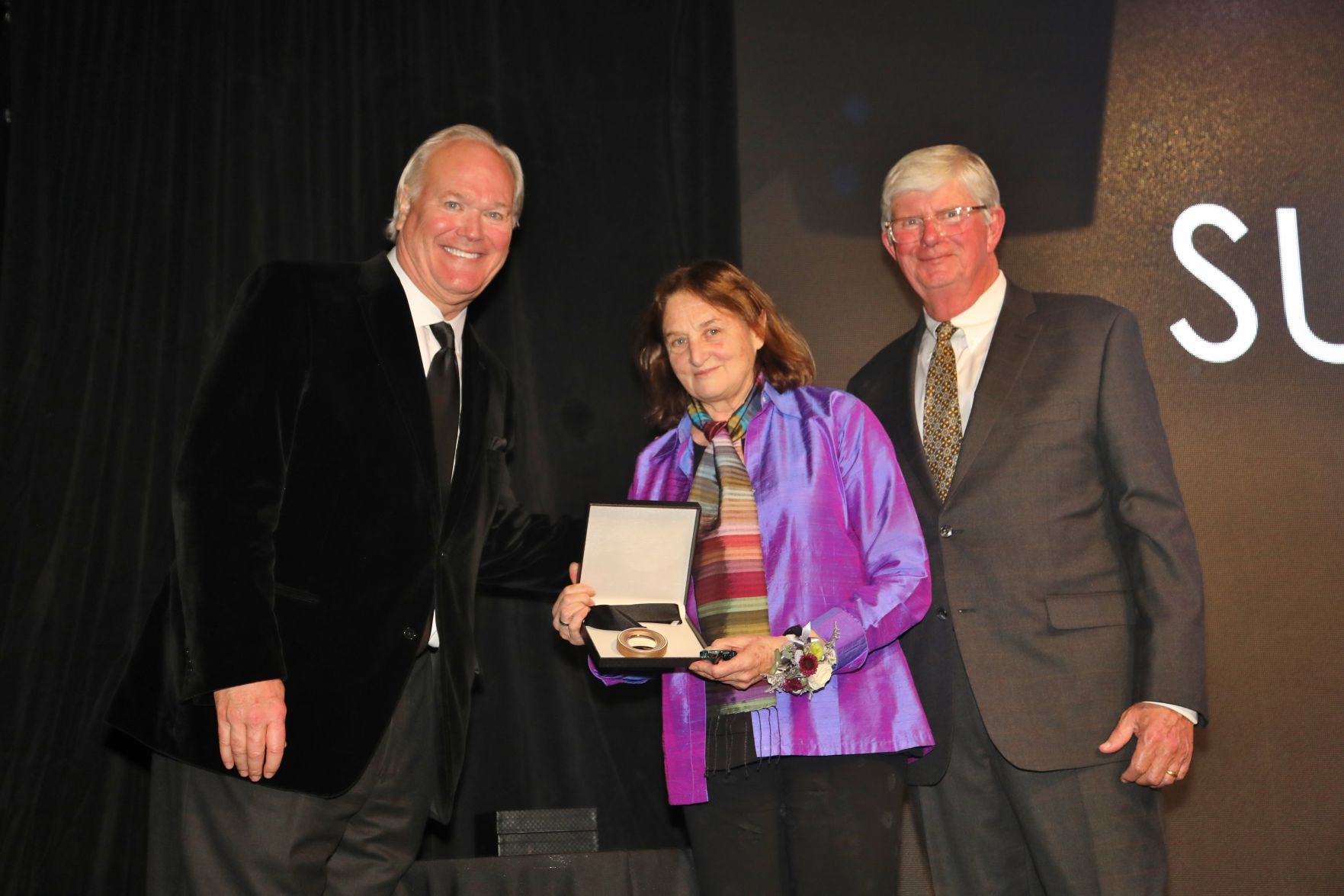 Dick Miles, Chairman of the Board, Susan Meiselas, honoree, Bob Bishop, chair of induction committee and board member